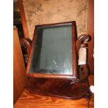 A William IV mahogany swing frame mirror with rectangular plate.