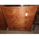 A Victorian pitch pine chest fitted two short and three long drawers with brass handles on plinth