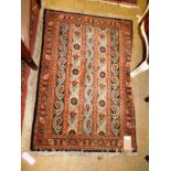 An Iranian kashkouli rug with striped pattern
