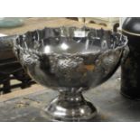 A silver plated grapevine punch bowl on stand