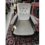 A Fritz Hanson style tan leather swivel office chair on chrome supports with matching footstool