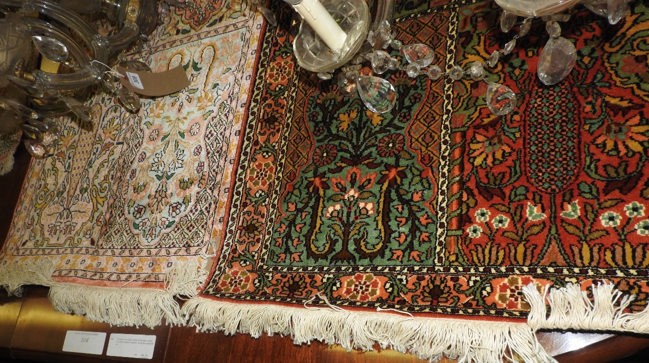 A collection of four various part silk prayer rugs