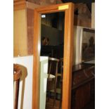 A large oak framed hall mirror