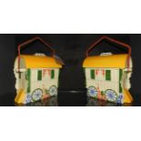 A pair of biscuit tin in the form of gypsy caravans