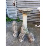 A reconstituted stone bird bath,