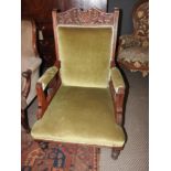 A pair of Victorian walnut armchairs upholstered in Green Velour