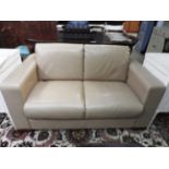 A contemporary designer two seater Art Deco style sofa,