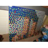 A Rubic cube composition by French artist 'Space Invader' with picture book,