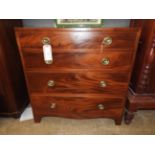 A 19th Century mahogany and elm chest fitted four long graduated drawers with brass oval plate