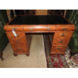 A walnut veneered Queen Anne style desk,