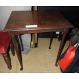 A mahogany hall table with spindle legs on pad feet