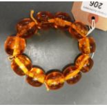 A faux amber bracelet with insects insets