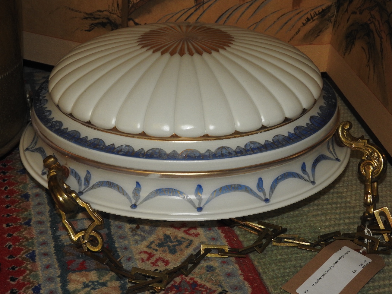 An opaline glass hanging shade with gilt mounts