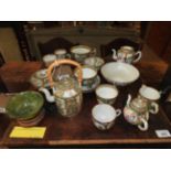 A collection of famille rose pottery, to include a teapot,