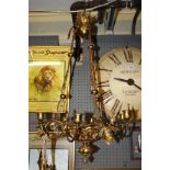 A late 19th Century Victorian gilt brass Gothic style three branched,