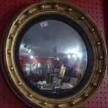 A Regency giltwood wall mirror, the convex,