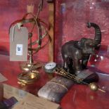 An Art Deco travel alarm clock with silver together with a bronzed elephant form mystery clock,