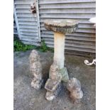 A reconstituted stone bird bath, and thr