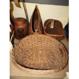 A collection of four wicker baskets to i