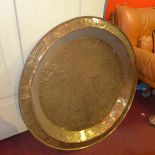 A large Eastern brass tray with embossed