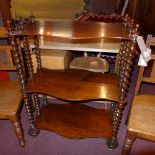 A Victorian rosewood whatnot of three se