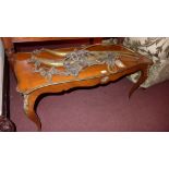 A French walnut low table with gilt meta