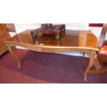 A French walnut low table with gilt meta