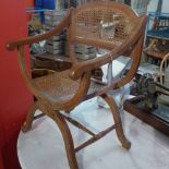 A French beech open armchair with caned