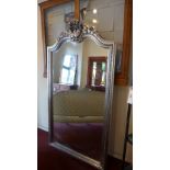 A large French style mirror, the arched