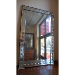 A vintage style wall mirror with rectang