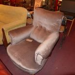 An Edwardian armchair upholstered in bro