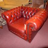 A pair of Chesterfield armchairs upholst