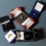 SOLD IN TIMED AUCTION A collection of five 9ct gold and other rings set faux diamonds