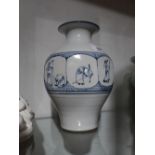 An Oriental porcelain vase, decorated wi