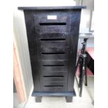 A contemporary ebonised tall chest of si