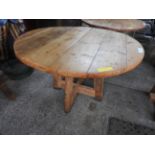 A reclaimed pine round country dining ta