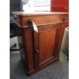 A mahgony commode chest with hinged pane