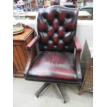 A Gainsborough design red leather swivel