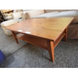 A country pine low table, with undertier