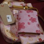 Two Louis Vuitton style pink leather shoulder bags and the matching purse