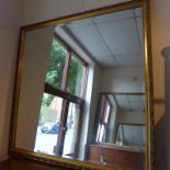 A pair of wall mirrors of large size with bevelled plates and gilt frames