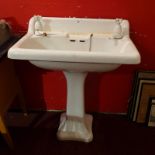 A vintage enamelled cast iron sink