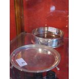 A hallmarked silver salver raised on three ball and claw feet together with a hallmarked silver