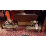 A pair of 19th century brass and iron fire dogs with floral swag and pinecone finial detail