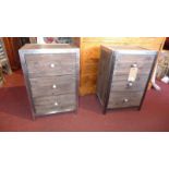 A pair of contemporary wooden and metal bound bedside chests fitted three drawers
