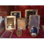 A collection of various silver plated photo frames