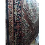 A fine north west Persian Bakhtiar carpet 250cm x 155cm central floral medallion on an ivory field