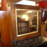 A 19th century rosewood and gilt wall mirror of square form