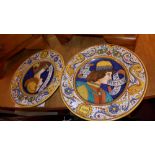 A pair of Italian Masoliza wall plates decorated with portraits