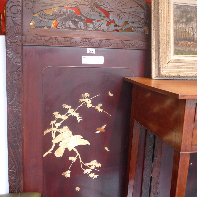 An early 20th Century Chinese hardwood two fold screen having pierced detail and images of birds in